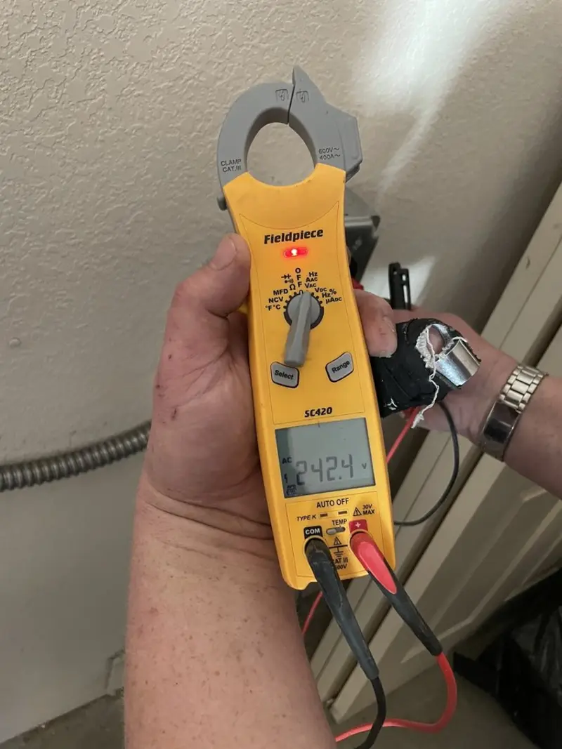 Voltage testing with clamp meter during Whole House Surge Protector in Burlington